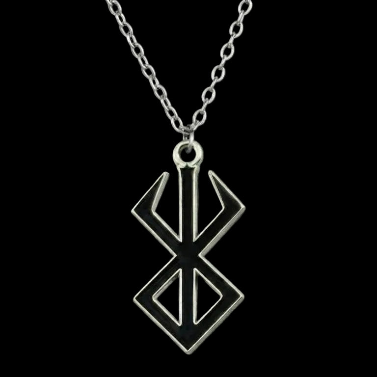 Silver pendant necklace on a dark background