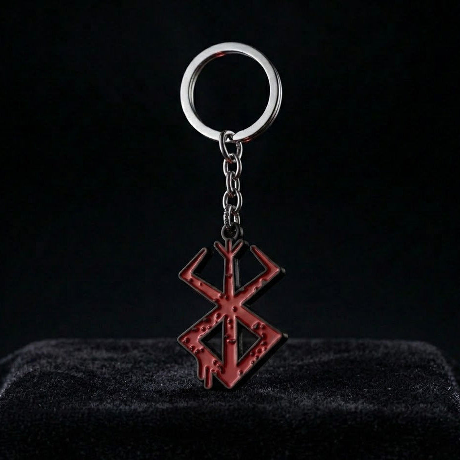 Keychain with a red symbol on a black background