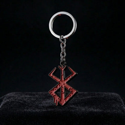 Keychain with a red symbol on a black background