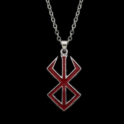 Red and silver pendant on a dark background