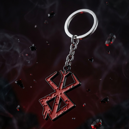 Keychain with a red symbol on a dark background