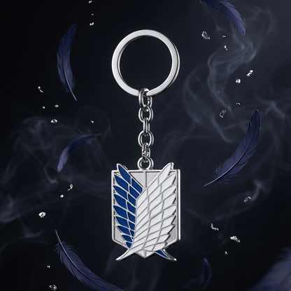 Keychain with a logo on a dark background with feathers