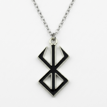 Necklace with a black and silver pendant on a white background
