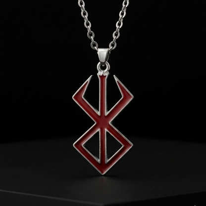 Red and silver pendant necklace on a black background